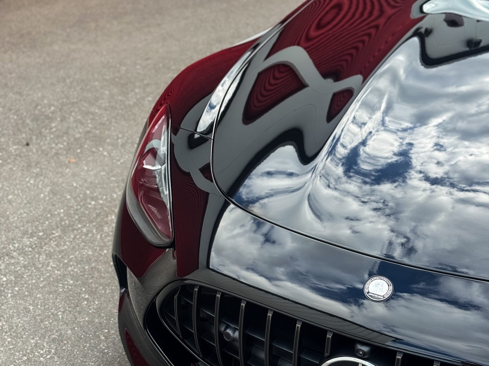Water-ready gloss on a coated black Mercedes hood in Charlotte NC