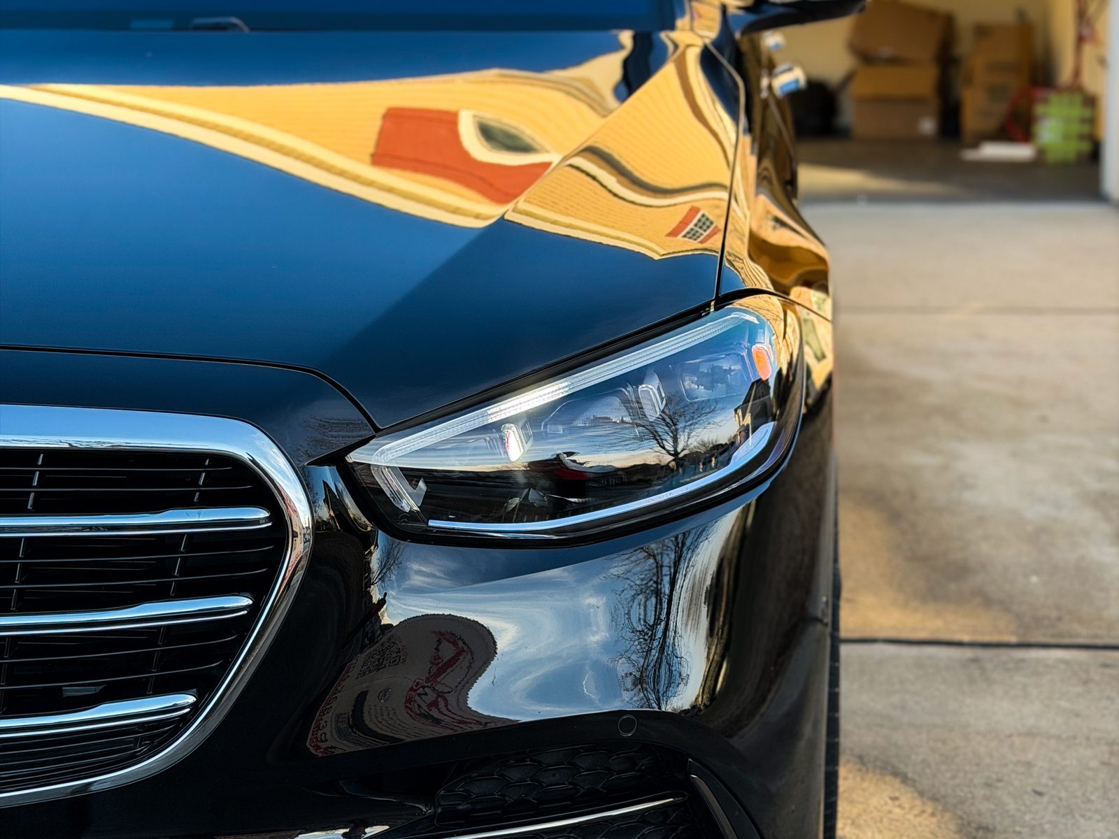 Mirror-like reflection on black Mercedes paint after ceramic coating, Charlotte NC