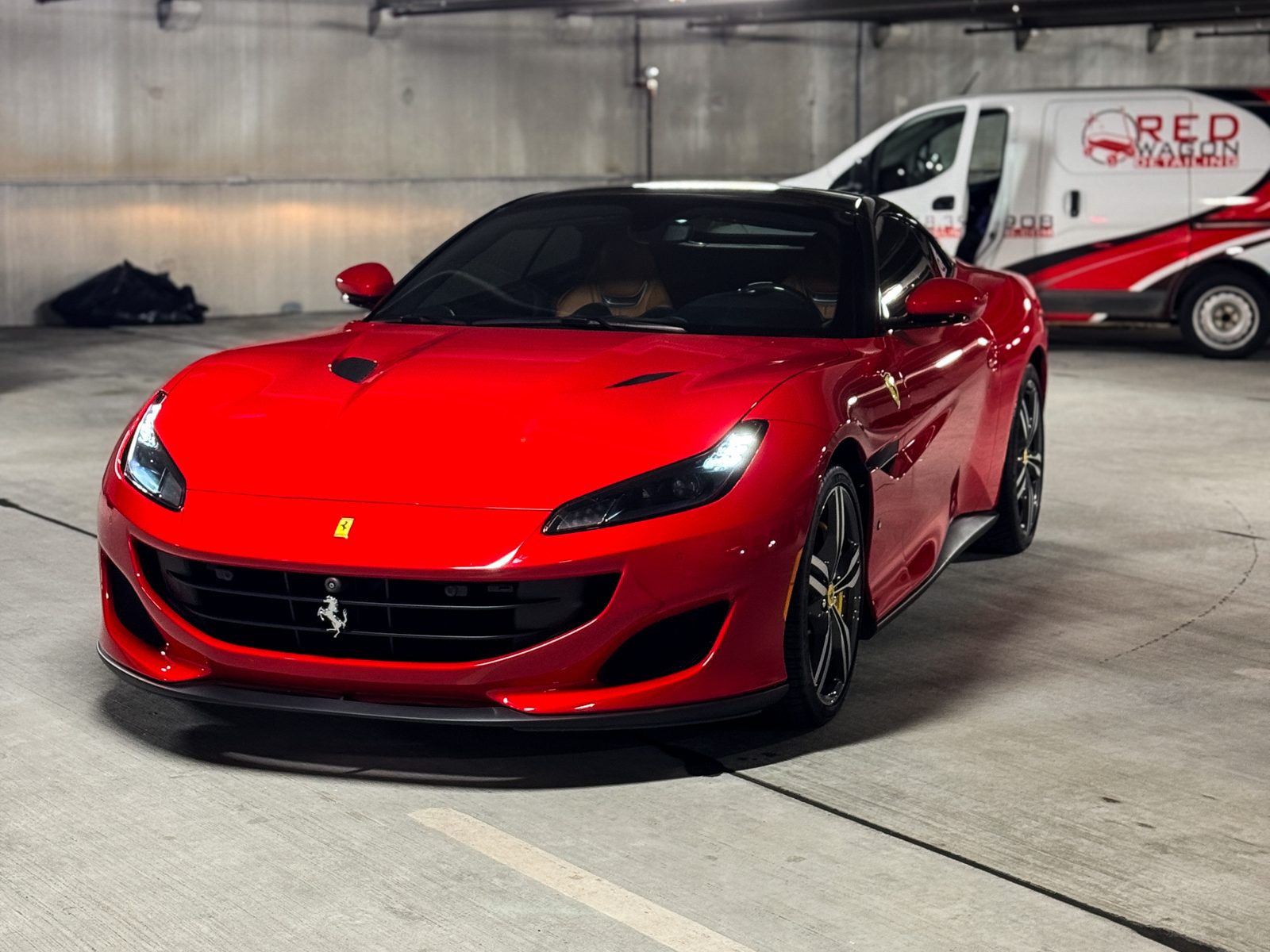 Red Ferrari convertible in the Red Wagon Detailing studio, Charlotte NC