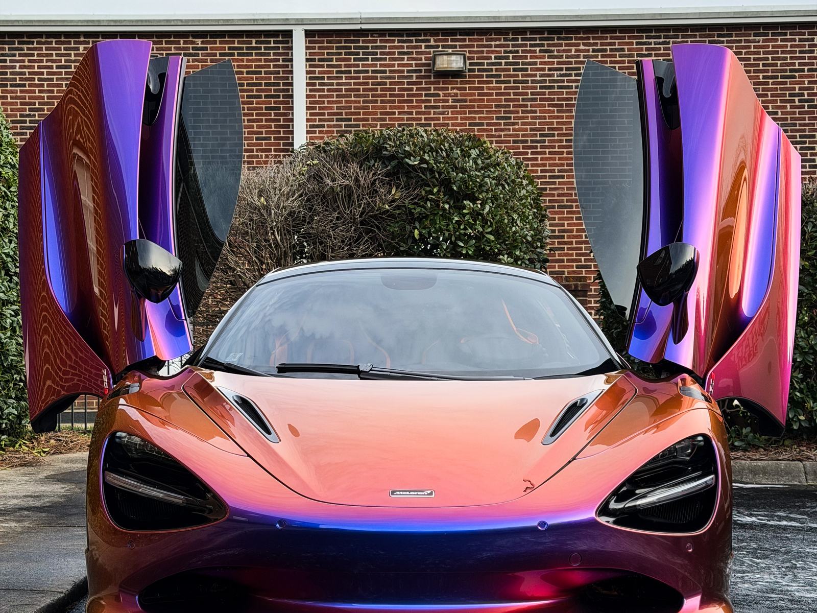 Color-shift McLaren with doors up outside a Charlotte NC shop